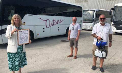 Harriett Baldwin MP gets a demonstration of Aston Coaches viral disinfectant fogging kit with Jon Elsdon and Richard Conway