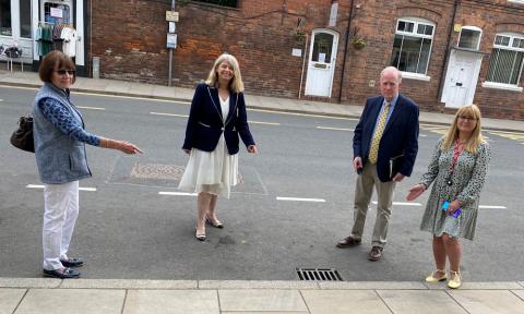 Councillor Bridget Thomas, Harriett Baldwin MP, Councillor David Chambers and town clerk Lesley Bruton check out the drains outside Tenbury’s Regal Theatre on Teme Street.